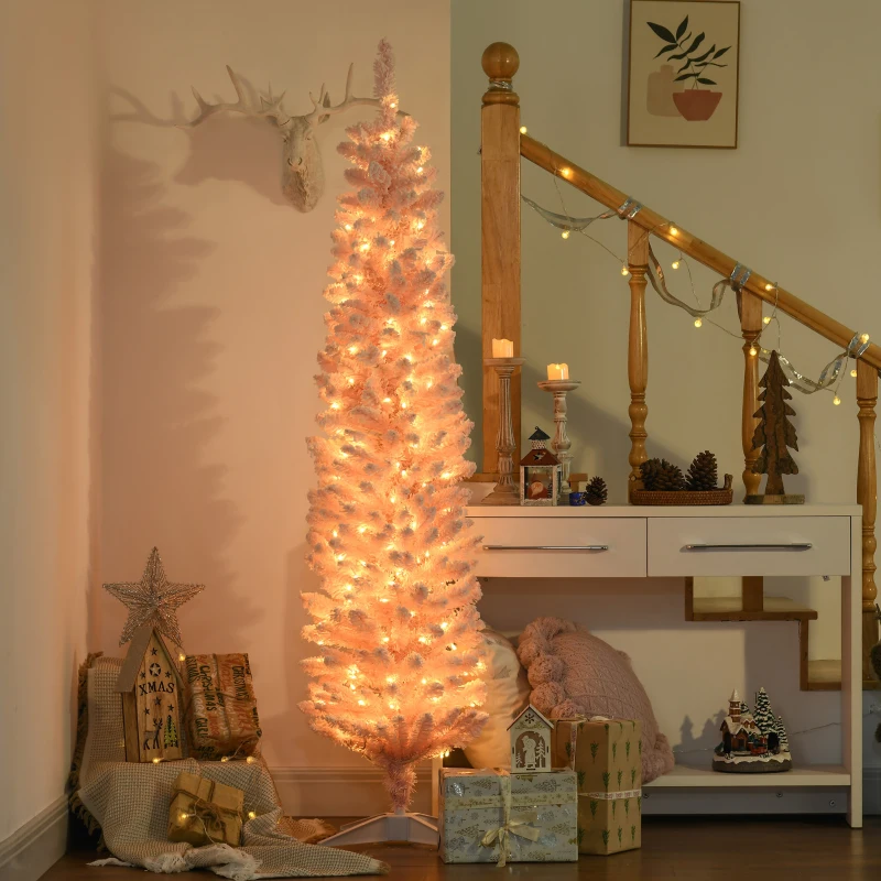 Tall pink prelit pencil Christmas tree glowing with warm lights