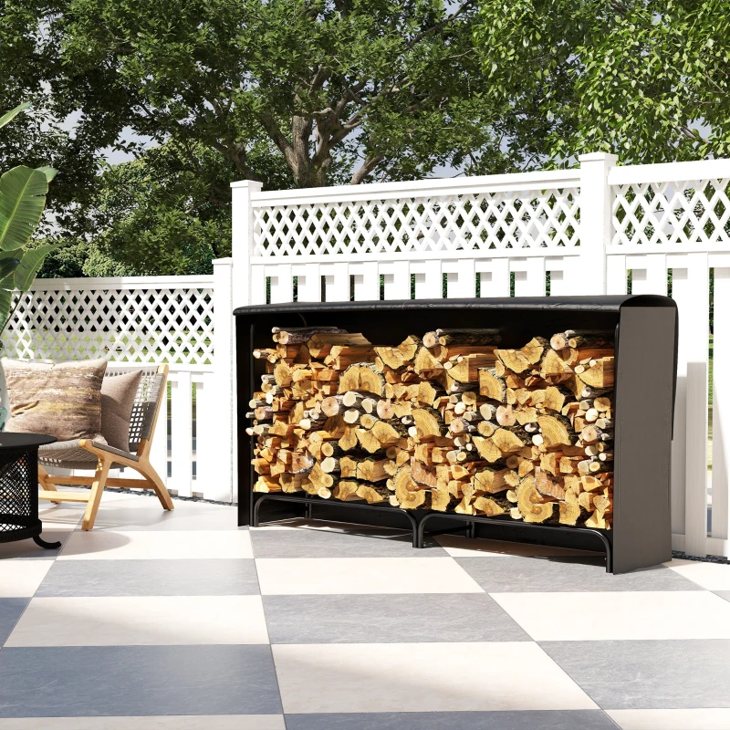  Outdoor patio firewood rack loaded with logs under black weatherproof cover