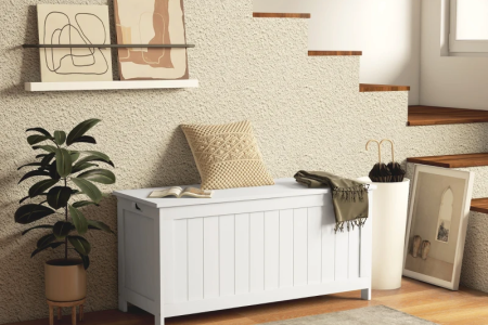 White HOMCOM storage trunk placed under staircase décor