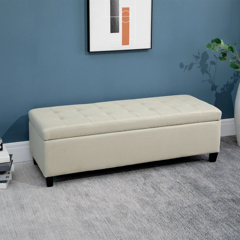 Cream tufted fabric bench with modern wall art above