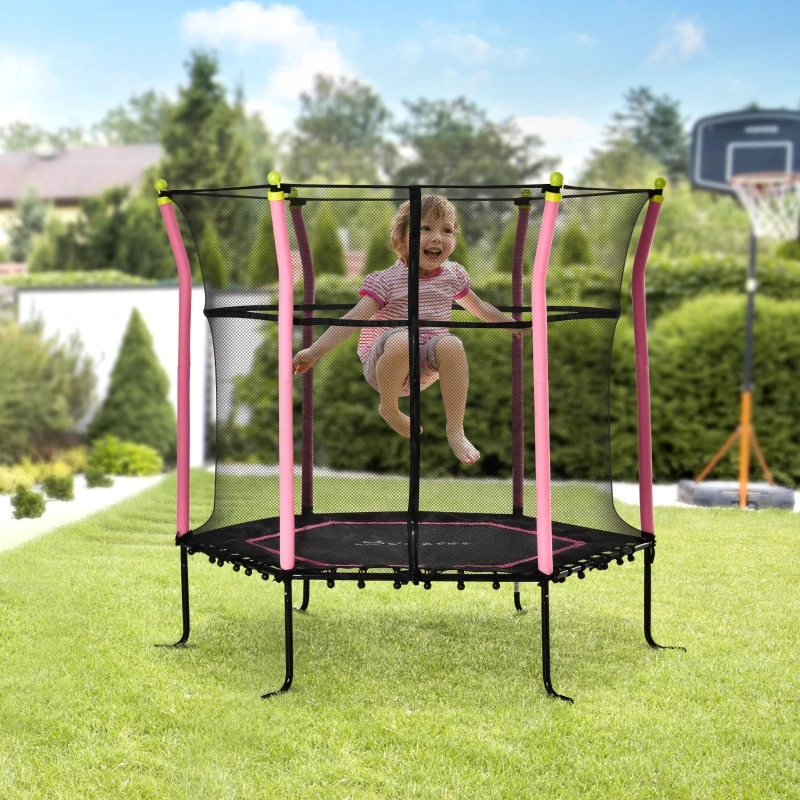 Child jumping on outdoor trampoline with safety net in sunny yard