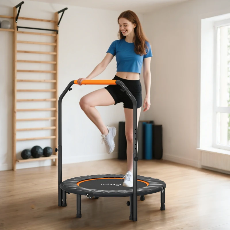 Woman working out on compact fitness trampoline with foam handle bar