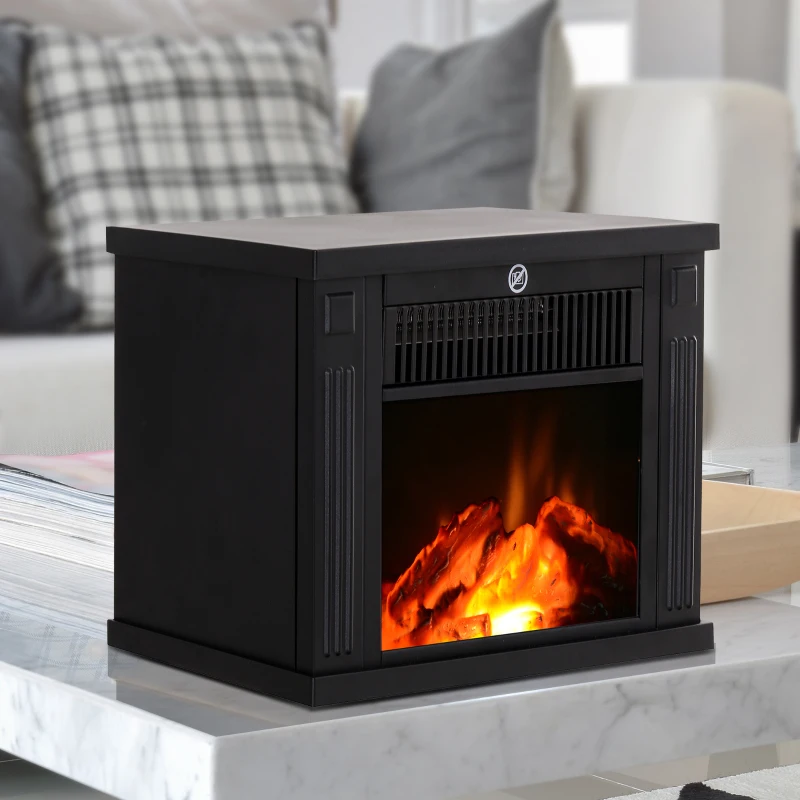 Small black electric fireplace heater with bright flames on table.