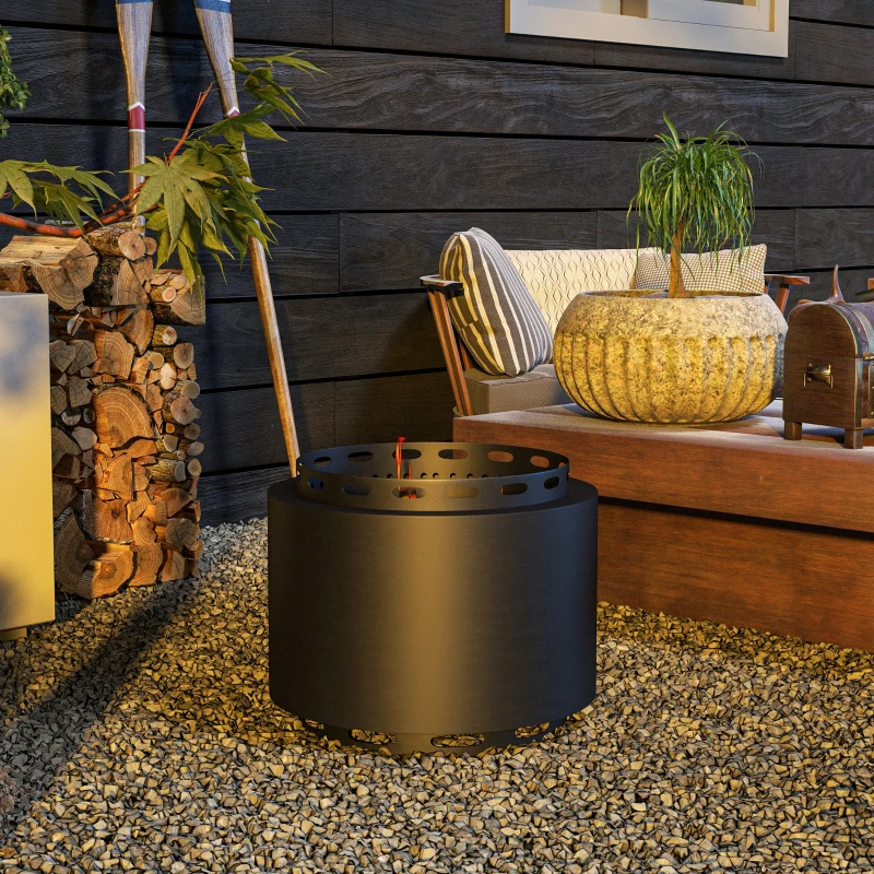 Black smokeless fire pit placed on gravel backyard area