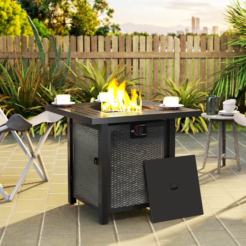 Square gas fire pit table with bright flames on patio