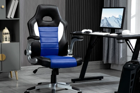 Sleek black ergonomic gaming chair setup with dual monitor desk