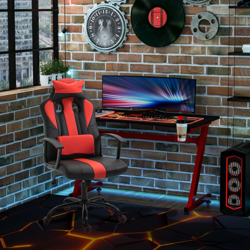 Red and black high-back racing gaming chair beside LED-lit gaming desk