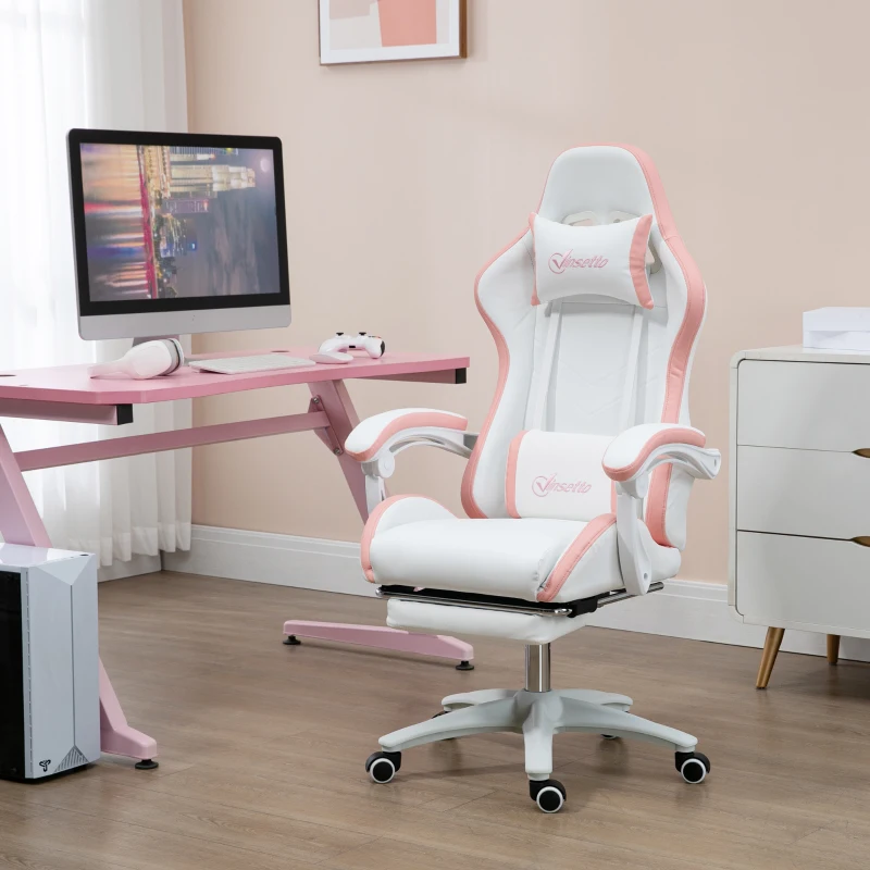 White and pink ergonomic gaming chair with footrest beside modern computer desk