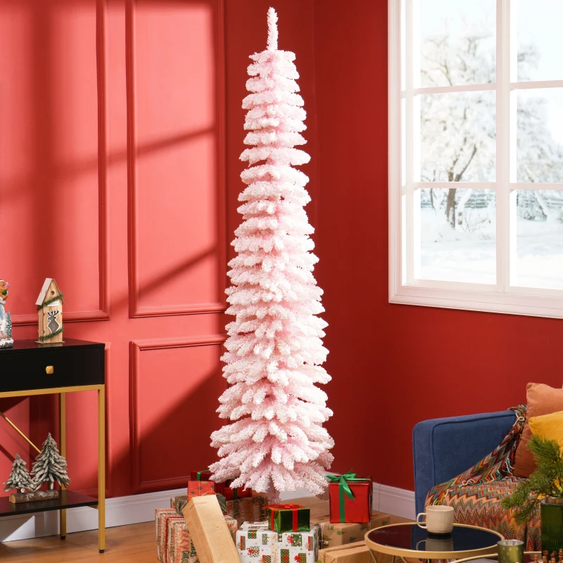 Elegant pink snow-flocked pencil Christmas tree beside window with gifts.