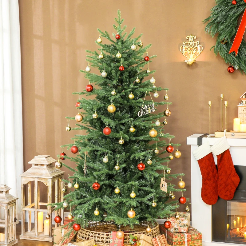 Decorated green Christmas tree with gold and red ornaments near fireplace.