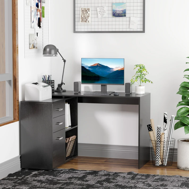 Black L-shaped corner desk with computer, drawers, and home décor.