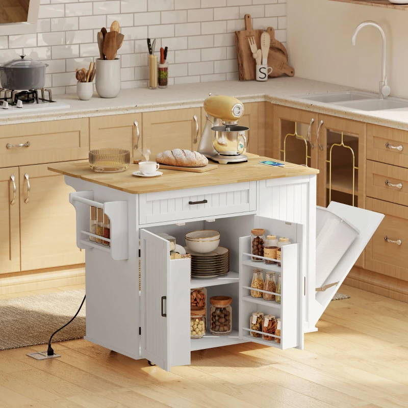 White kitchen island with wood top, charging ports, and open cabinets.