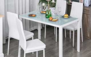 Modern white glass kitchen table and chairs set in dining room setup.