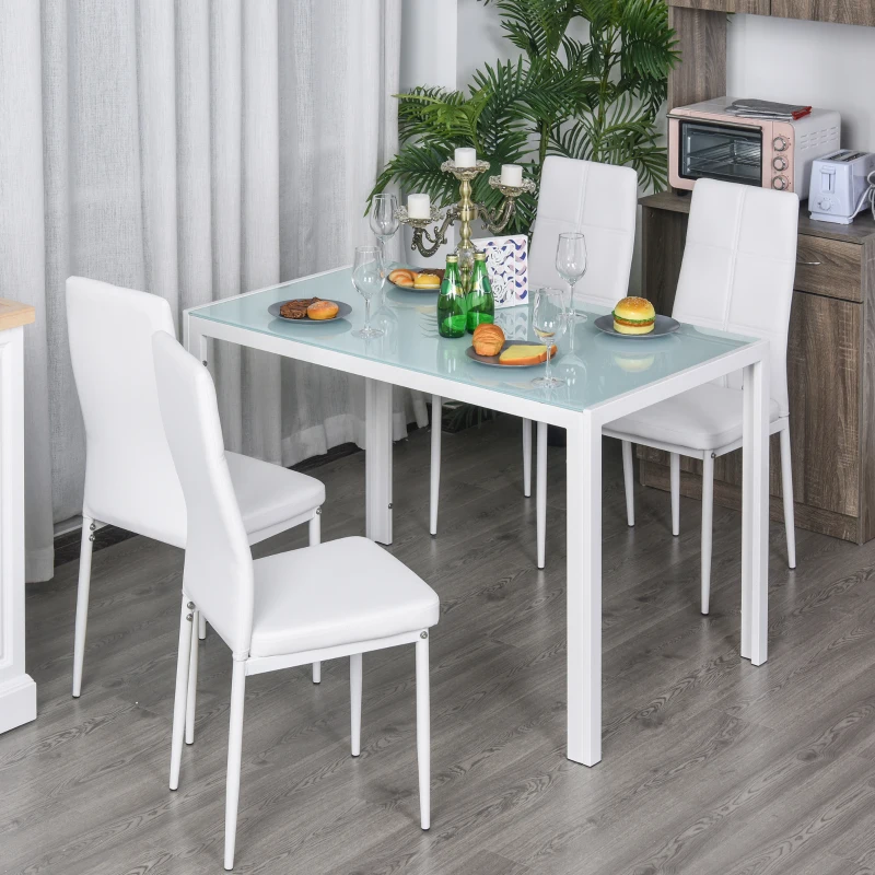 Modern white glass kitchen table and chairs set in dining room setup.
