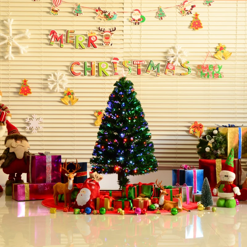 Decorated pre-lit Christmas tree glowing with colorful lights and holiday gifts underneath.