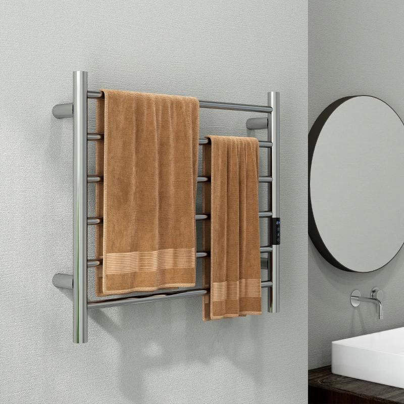 Modern bathroom with chrome towel warmer holding clean brown towels.