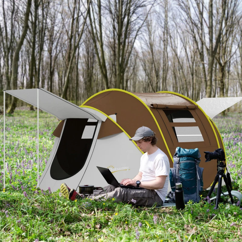 Brown pop-up tent with dual porches in forest clearing.