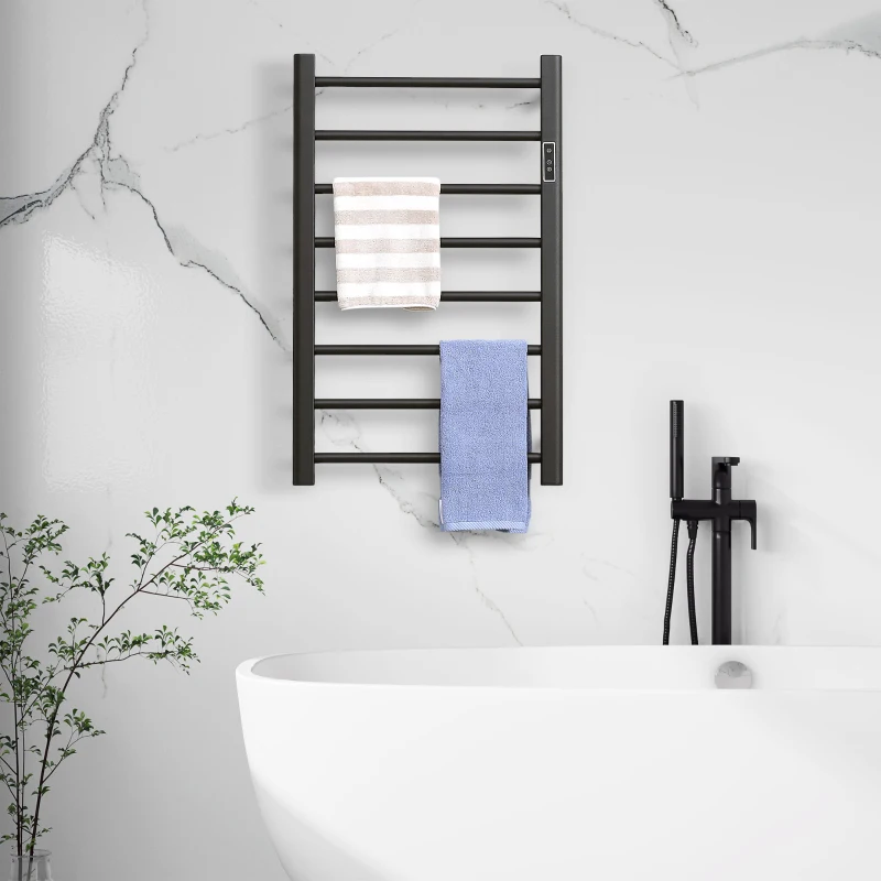 Chrome heated towel rail with folded beige and pink towels.