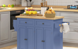 Blue kitchen island with wooden countertop, fruit basket, and kitchen utensils in a cozy modern kitchen setting