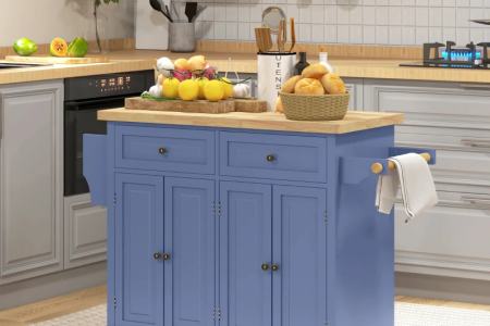 Blue kitchen island with wooden countertop, fruit basket, and kitchen utensils in a cozy modern kitchen setting