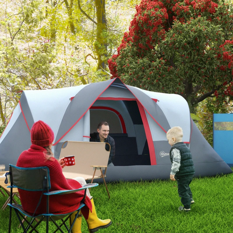 Spacious green family camping tent with mesh windows in forest.