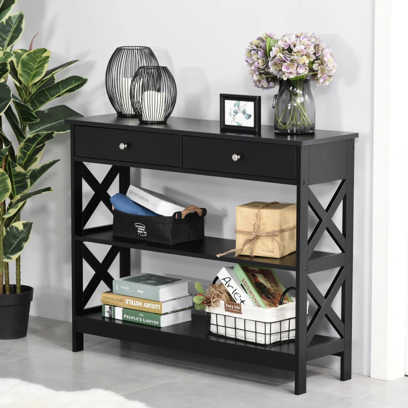Black console table styled with books, baskets, flowers, and modern decorative accents.