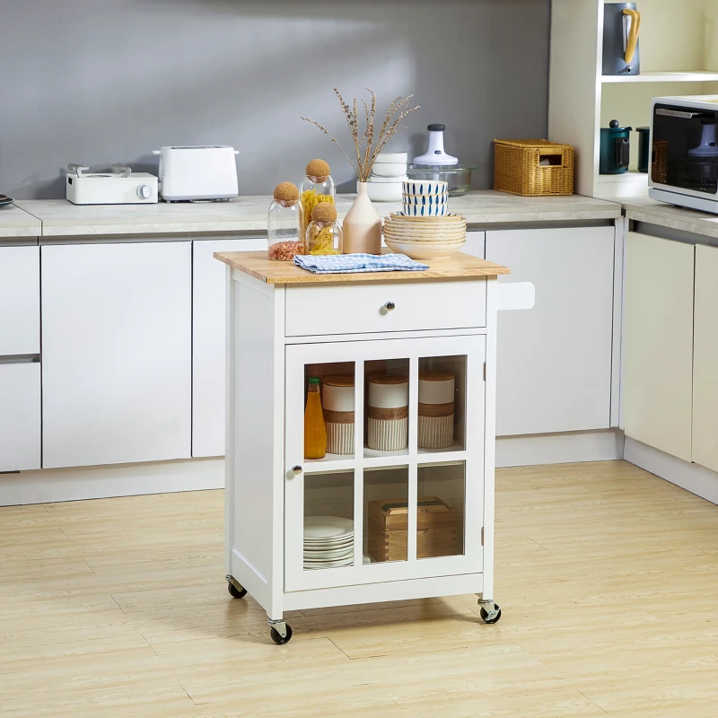 White kitchen cart with wooden top, open drawer, glass jars, and baskets in a bright kitchen.