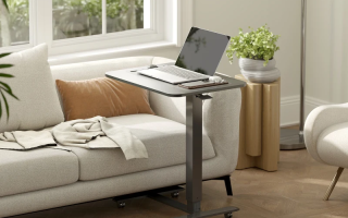 Finished adjustable standing desk with laptop setup in a modern living room.
