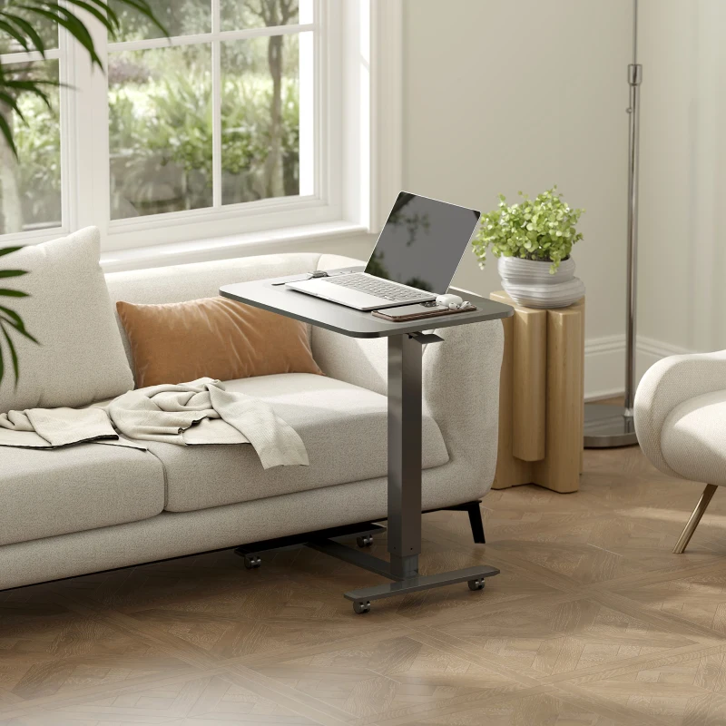 Finished adjustable standing desk with laptop setup in a modern living room.
