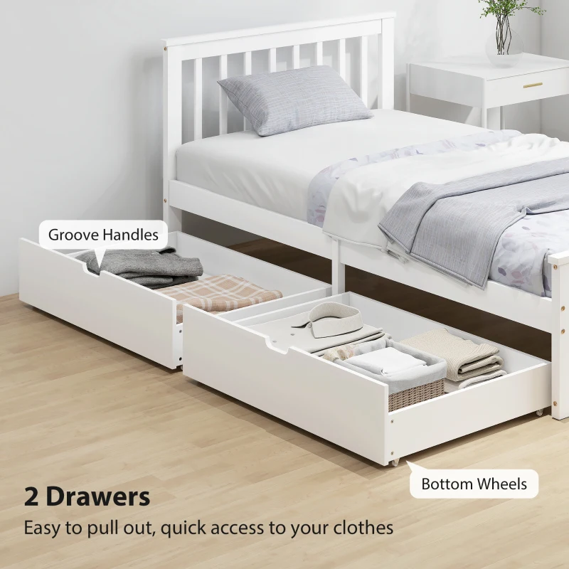 White twin bed with under-bed drawers and folded linens in minimalist room.