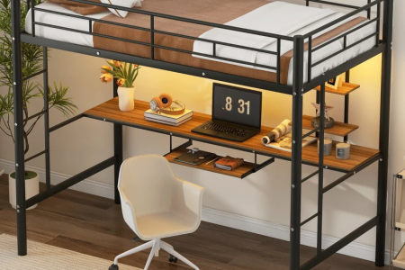 Symmetrical twin beds with green throws and mustard pillows in bright bedroom.