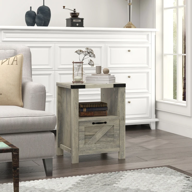 Rustic grey side table with drawer and shelf beside neutral armchair in modern farmhouse décor.