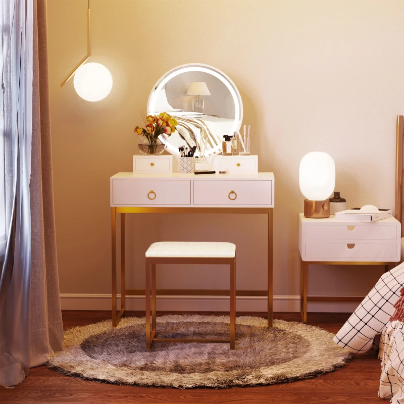 Elegant vanity table with LED mirror, stool, and gold accents in softly lit bedroom.