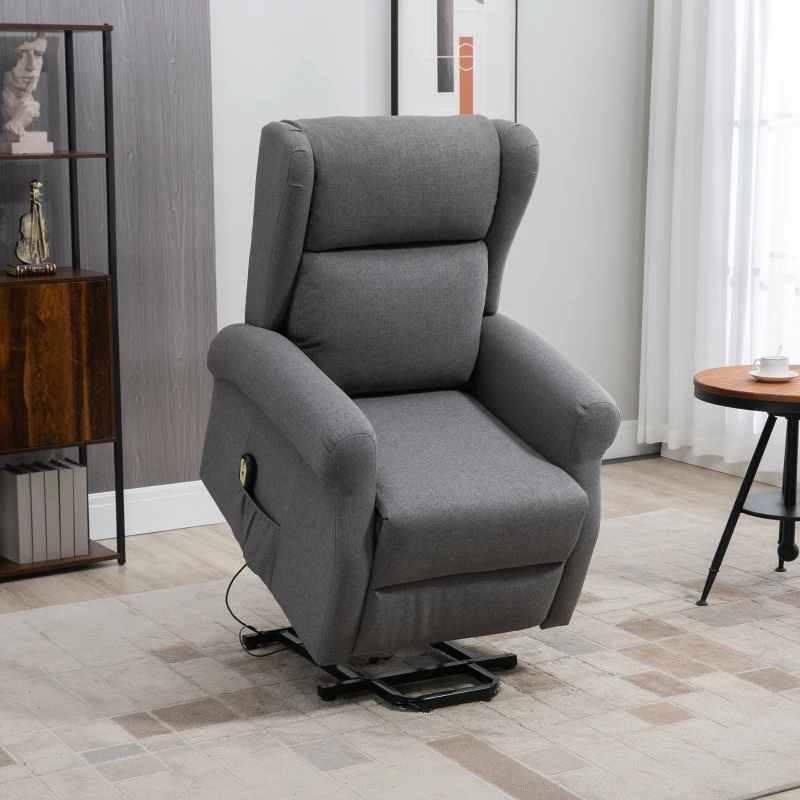 Grey power lift recliner chair with footrest in bright modern living room corner.