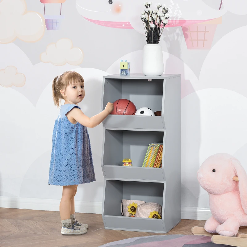 Toddler placing toys in tall gray open nursery shelf