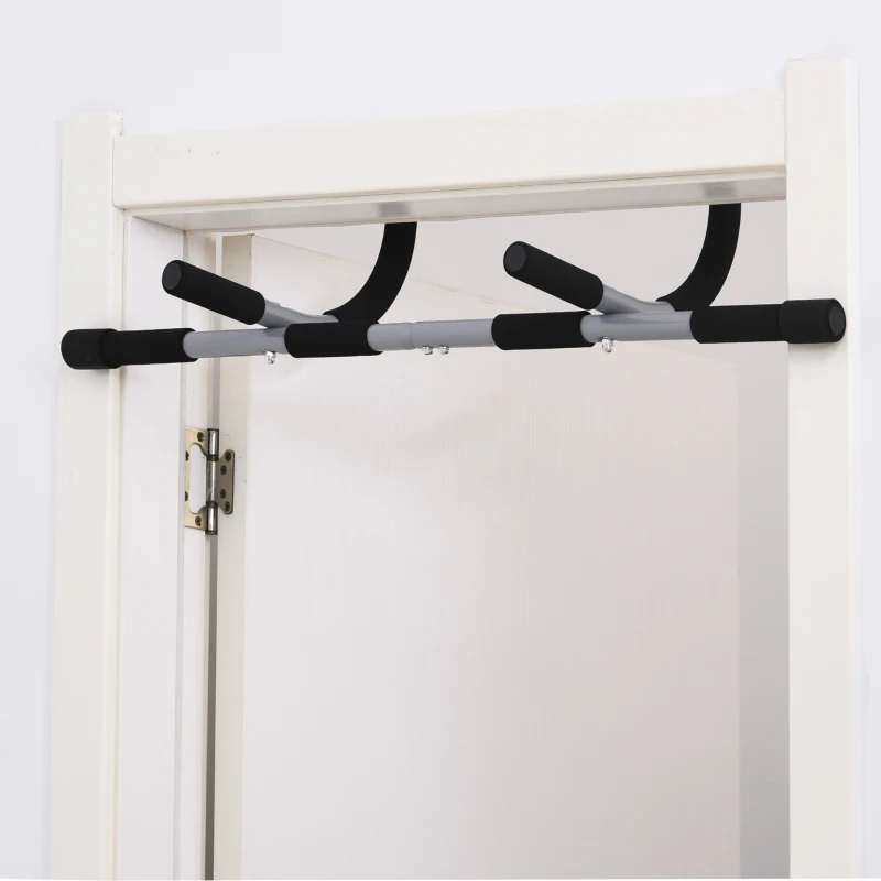 Door-mounted pull-up bar with foam grips for home workouts.