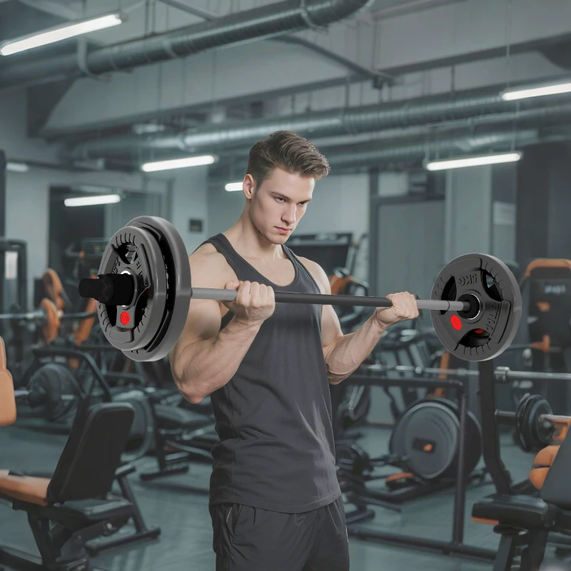Man lifting barbell with black weight plates in gym.