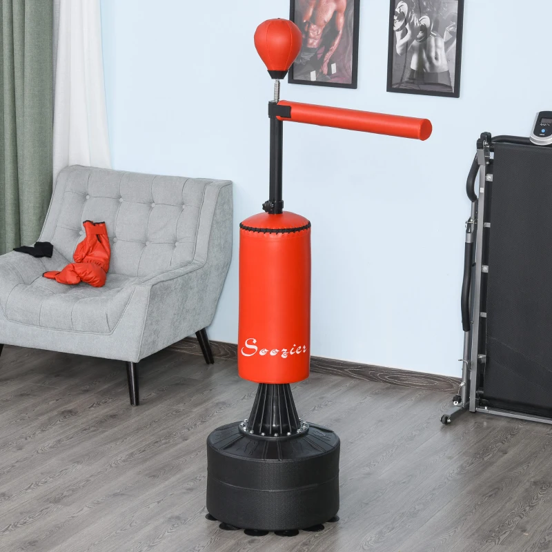 Red freestanding boxing punch bag with reflex bar in home gym.