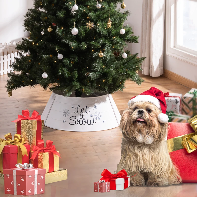 Festive Christmas tree with dog in Santa hat beside wrapped gifts.