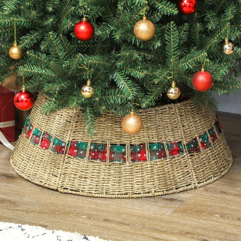 Woven rattan Christmas tree skirt with red and green plaid ribbon.