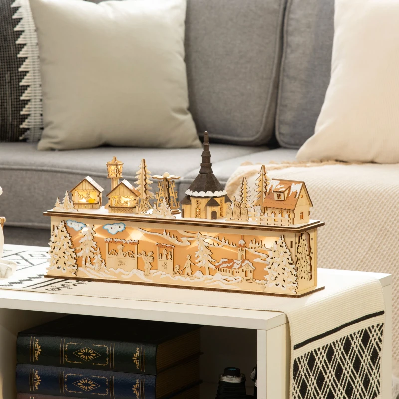 Lighted wooden Christmas village houses displayed on living room table.