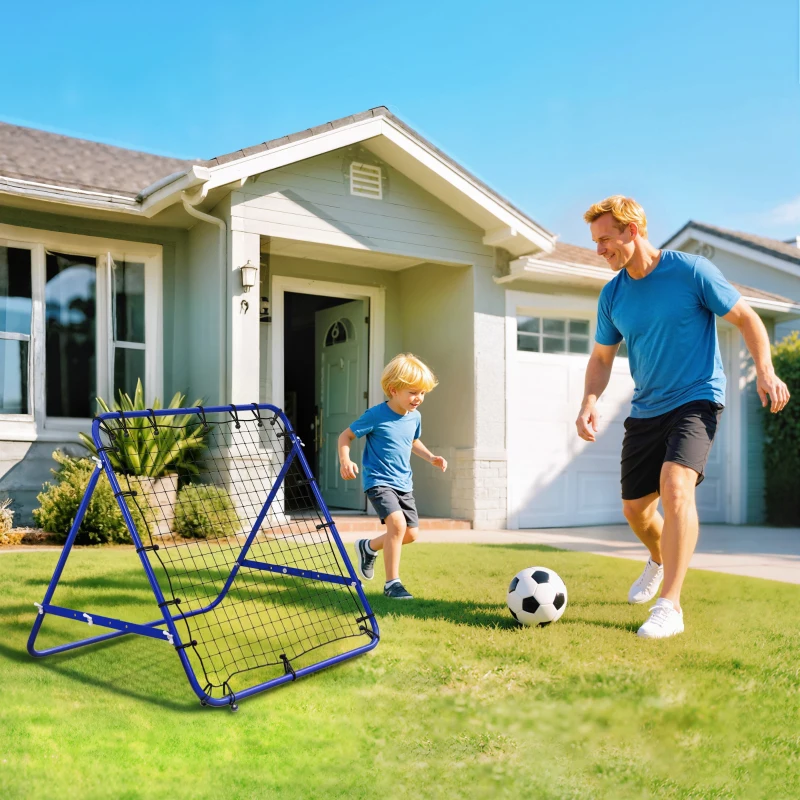 Father and son practicing soccer with yellow rebounder net outdoors.