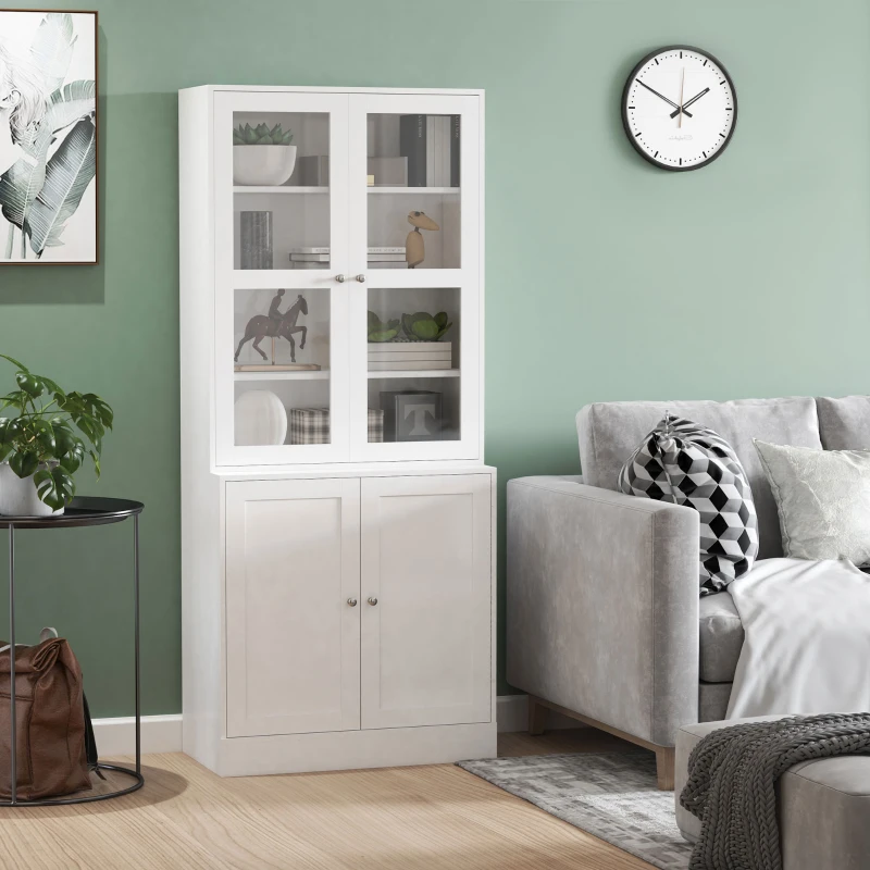 Tall white bookshelf with glass doors and décor beside grey sofa.