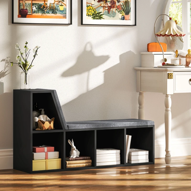 Black cube bookshelf with cushioned reading seat in cozy corner space.