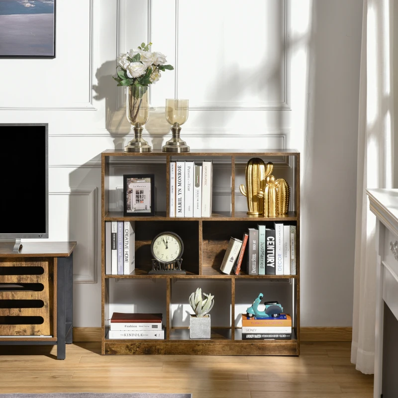 Rustic brown cubical bookshelf with books and gold décor near window.