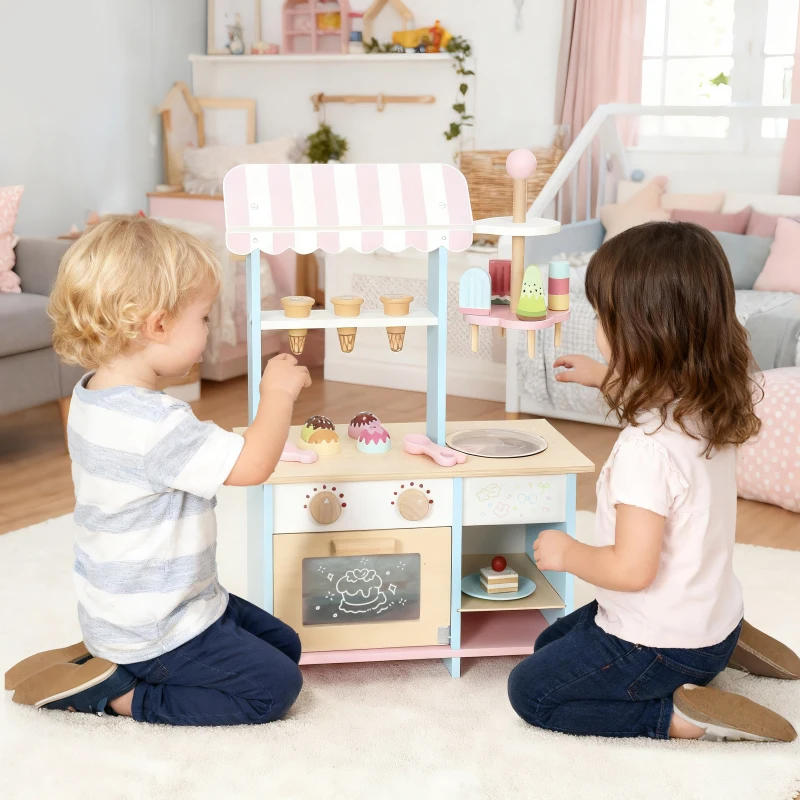 Two kids playing with pastel wooden ice cream and dessert play kitchen set.