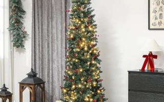 Tall slim pre-lit Christmas tree with warm LED lights and wrapped gifts in a cozy living room