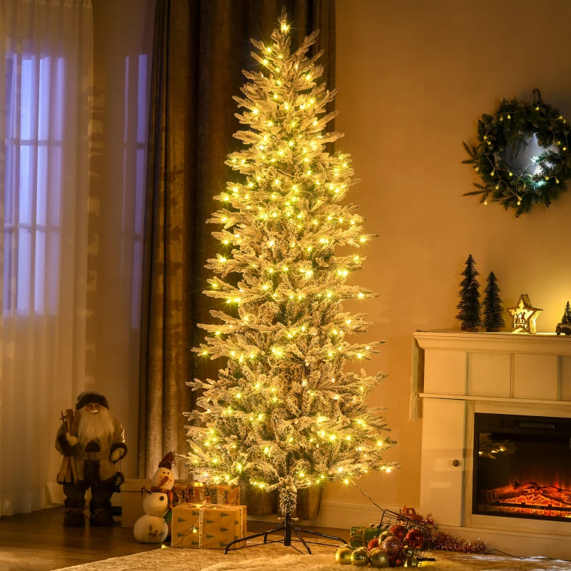 Tall Arctic fir pre-lit Christmas tree glowing warmly beside a fireplace and holiday décor