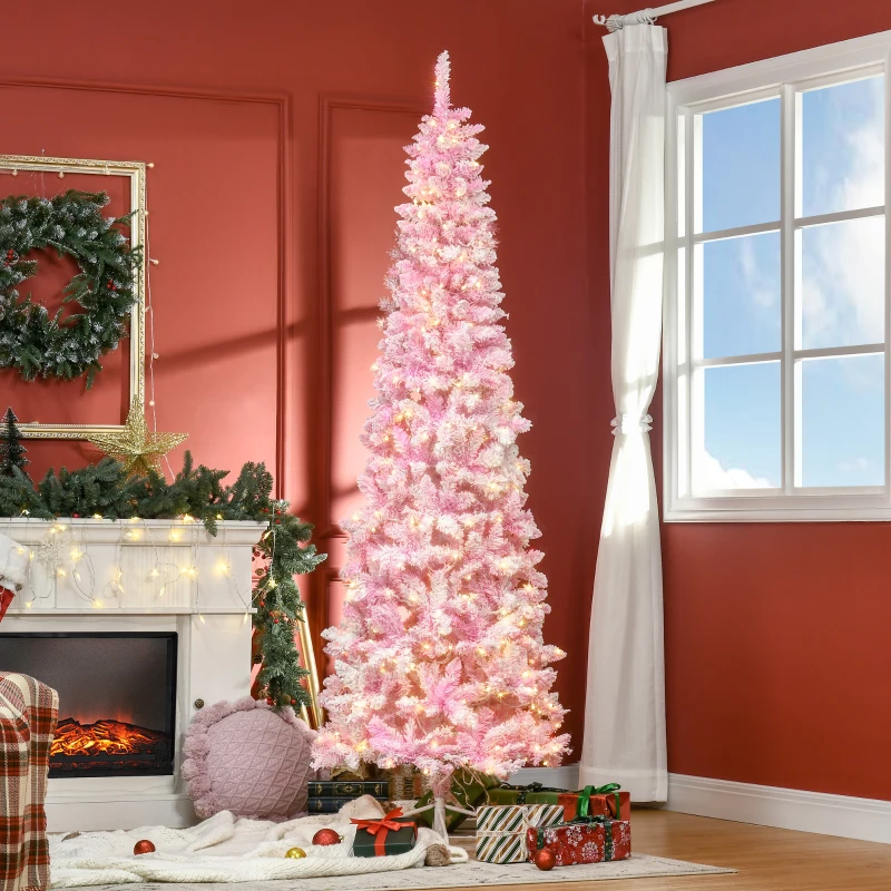 Tall pink pencil Christmas tree glowing with warm white lights near fireplace and presents.