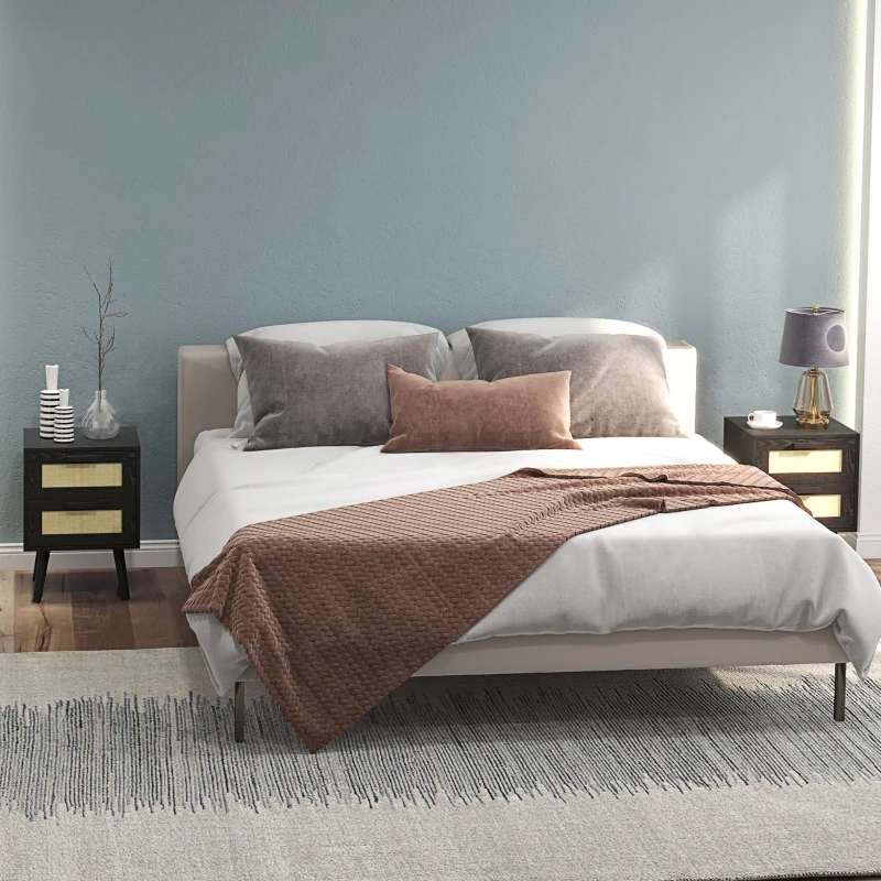 Contemporary bedroom with matching black boho nightstands and brown bedding.